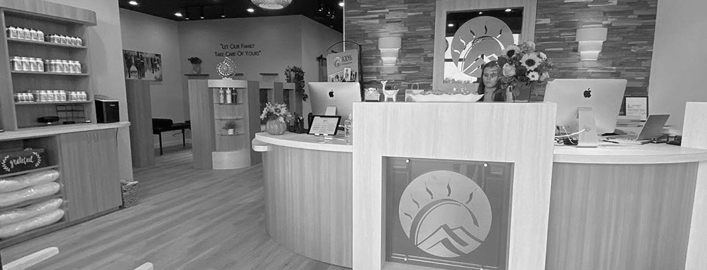 Front desk and reception area at 100% Chiropractic North Cumming